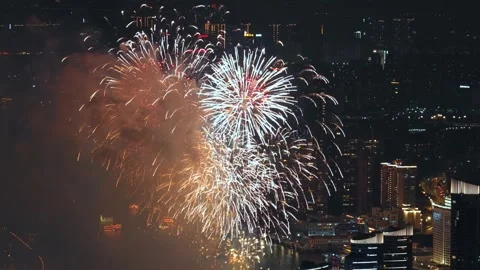 Aerial view multi-colored fireworks sky over night city. Firecracker background. Video stock 340637322