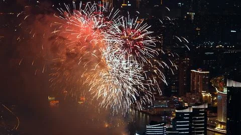 Aerial view multi-colored fireworks sky over night city. Firecracker backgr.. Stock Photos