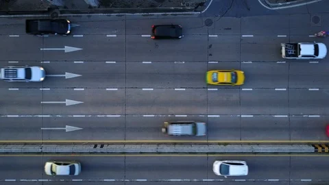 Aerial view of multi lane road with arrow symbol. Urban cars speeding Stock-Footage 90803247