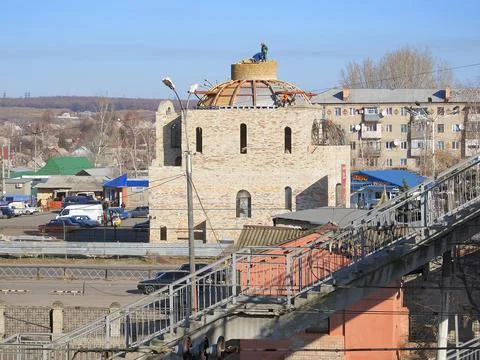 Aerial view of a multi-level brick building with dome, under maintenance, s.. Stock Photos