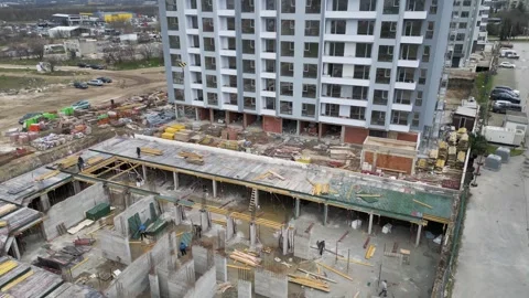 Aerial View of Multi-Stage High-Rise Construction Site Stock Footage 331536202