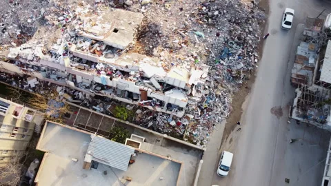 Aerial view of a multi-storey building destroyed in the earthquake Stock Footage 258058694