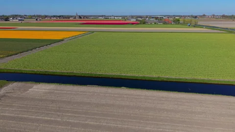 Aerial view of multicolored agricultural fields with plowed soil, green Stock Footage 336852765