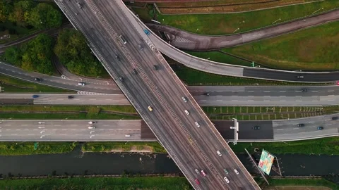 Aerial view of multilane highway traffic, showcasing Kuala Lumpur modern urban Stock Footage 302521667