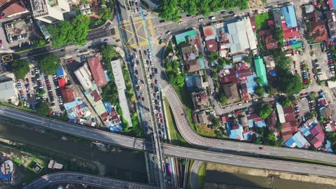 Aerial view of multilane overpass and canal with morning commute in Kuala Lumpur Stock Footage 327121610