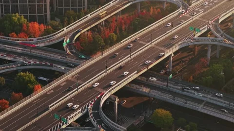 Aerial view of multilevel highway interchange with car and bus traffic in China Stock Footage 325545297