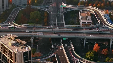 Aerial view of multilevel highway interchange with car and bus traffic in China Stock Footage 326178705