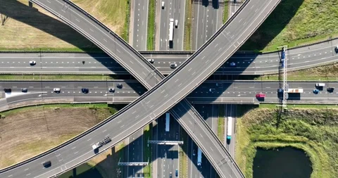 Aerial view of a multilevel highway interchange with busy car traffic. Stock Footage 327797616