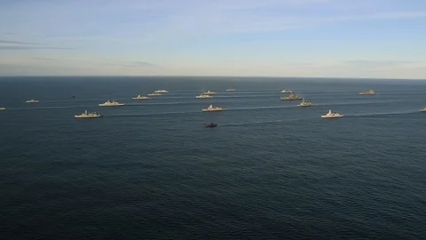 Aerial view of multiple navy ships navigating in the ocean Stock Footage 114017898