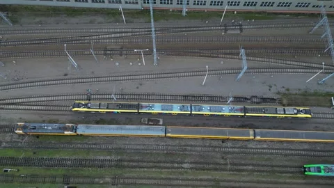 Aerial view of multiple trains on tracks, showcasing the intricate layout Stock Footage 323235766