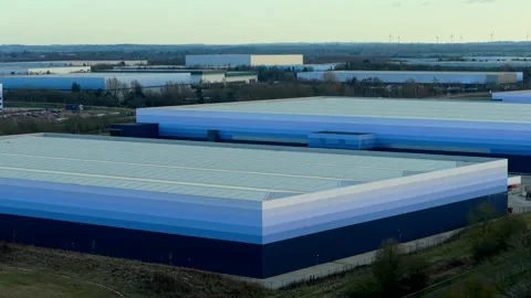 Aerial view of multiple warehouse buildings operating logistics infrastructure Stock Footage 326676905