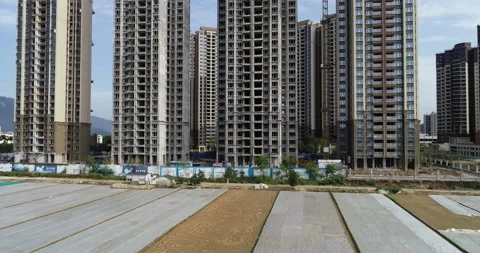Aerial view of multistory apartment construction site in China Stock Footage 168915110
