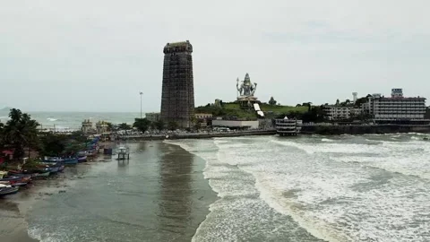 Aerial View of Murudeshwar Temple and Shiva Statue with Ocean Waves Stock Footage 281252120