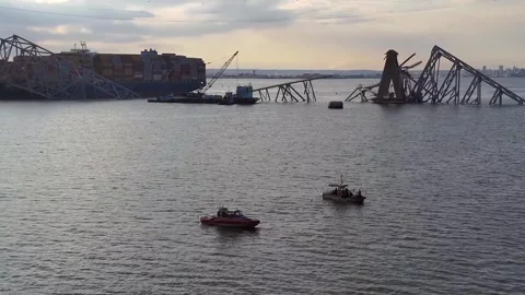 Aerial view of the MV Dali container ship wedged under Francis Scott Key Bridge Stock Footage 271233548