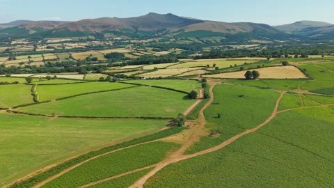 Aerial View of Mynydd Illtyd Fields with Pen y Fan Peak, Drone Shot Stock Footage 341774323