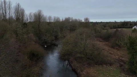 Aerial View of Narrow River Through Leafless Trees in Rural Landscape Vidéo 332738884