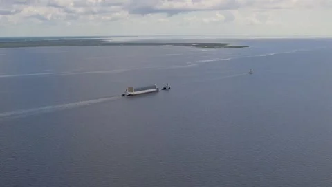 Aerial view NASA's Pegasus Barge ferrying Artemis II Rocket stage Gulf of Mexico Stock Footage 281241683