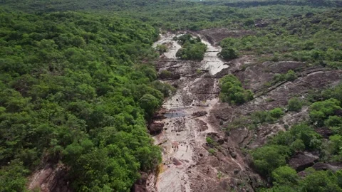 Aerial View of Natural Pools, Forest, and Rocky Terrain on a Cloudy Day Stock Footage 332728880