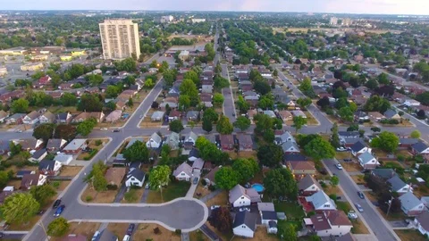 Aerial view of neighbourhood in the evening (north) Stock Footage
