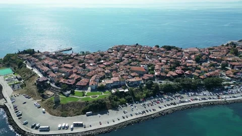 Aerial view of Nessebar, Bulgaria, with rooftops, park, ruins and turquoise sea Stock Footage 346553352