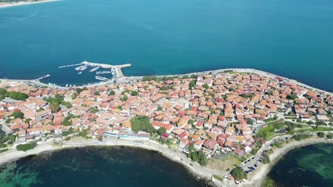 Aerial view of Nessebar, Bulgaria, with rooftops, park, ruins and turquoise sea Stock Footage 346553383