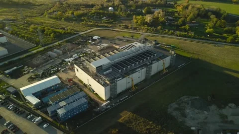 Aerial view of a new AI data center under construction during sunset Stock Footage 347574734