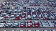Aerial View New Cars Lined Up At Distribution Centre. Stock Footage
