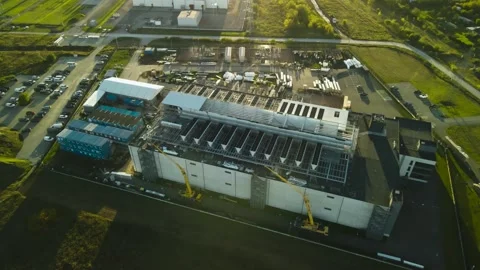 Aerial view of a new data center building construction at sunset Stock Footage 347574662