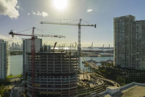 Aerial view of new developing residense in american urban area. Tower cranes at Stock Photos