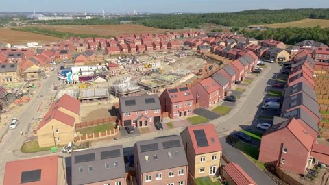 Aerial view of new homes being built due to UK housing shortage Stock Footage 340843166