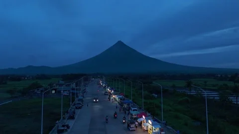 Aerial view of the new road capturing Mount Mayon at dusk. Stock Footage 336870106