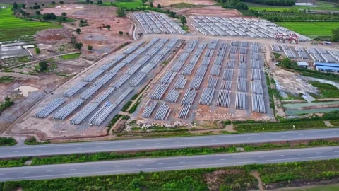 Aerial view of a new road development with cranes and Heavy Equipment. Stock Footage 279621353
