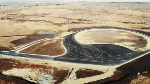 Aerial view of new road for testing cars. Fresh black asphalt with grid of white Stock Footage 167487129