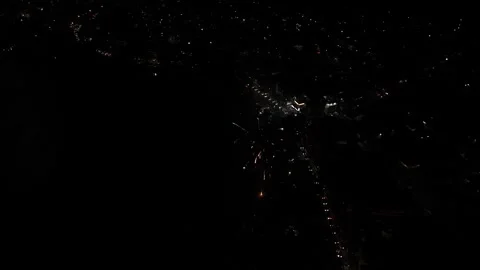 Aerial view of New Year fireworks creating bright explosions in the night sky Stock Footage 325949182
