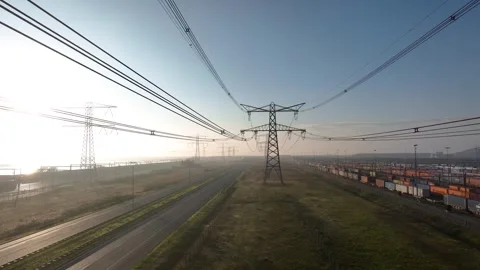 Aerial view of a newly installed power line pylon Stock Footage 309461116