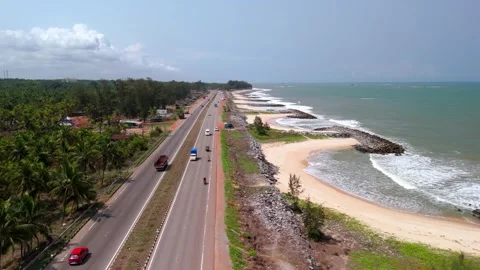 Aerial View of NH 66 Coastal Highway Running Along Seaside Landscape Stock Footage 341309341