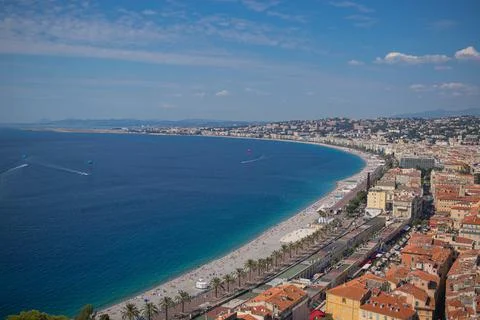 An aerial view of Nice Code de Azur beach with dense coastline buildings unde Stock Photos