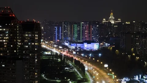 Aerial view of a night avenue in big city. Time lapse. Zoom out and tilt down 스톡 동영상 119662653