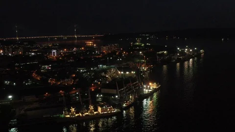 Aerial view of the night city overlooking the coastline. Stock Footage