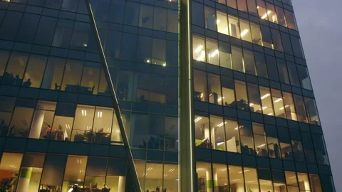 Aerial view of the night skyscraper. Close-up of office windows. Stock Footage 170826000