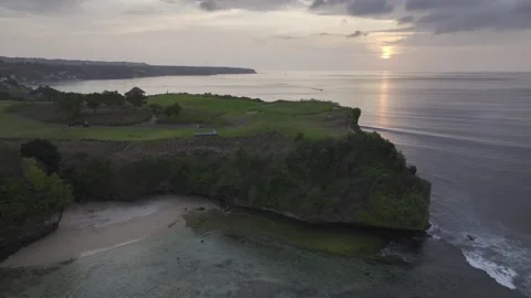 Aerial view of nightfall landscape of coast cliff of Jimbaran in Bali Indonesia Video stock 266896214