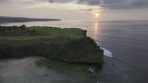 Aerial view of nightfall landscape of coast cliff of Jimbaran in Bali Indonesia Stock-Footage 266896331