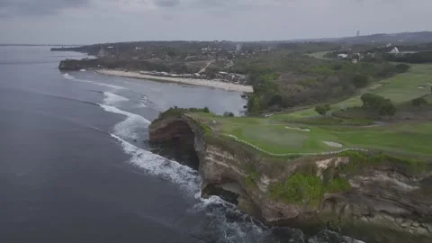 Aerial view of nightfall landscape of coast cliff of Jimbaran in Bali Indonesia Video stock 266896352