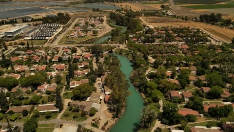 Aerial View of Nir David Kibbutz and Turquoise Water Canals Israel Vídeos de archivo 337630016