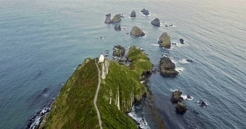 Aerial view of Nugget Point Lighthouse at sunset, NewZealand. Stock Footage 73127649