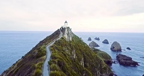 Aerial view of Nugget Point Lighthouse at sunset, NewZealand. Stock Footage 73127715