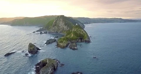 Aerial view of Nugget Point Lighthouse at sunset, NewZealand. Stock Footage 73127749