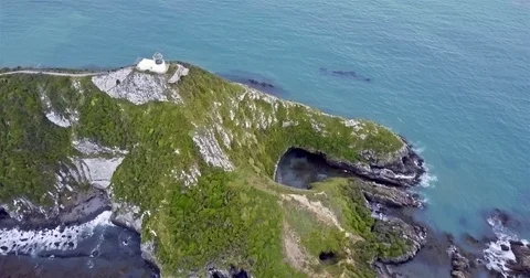Aerial view of Nugget Point Lighthouse at sunset, NewZealand. Stock Footage 73127804