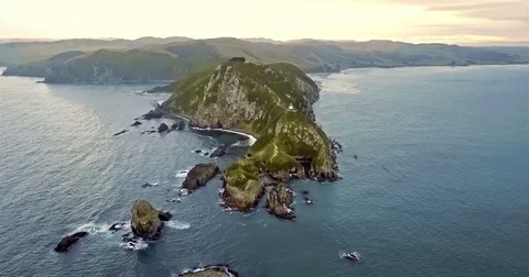 Aerial view of Nugget Point Lighthouse at sunset, NewZealand. Stock Footage 73127888