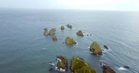 Aerial view of Nugget Point Lighthouse at sunset, NewZealand. Stock Footage 73127895